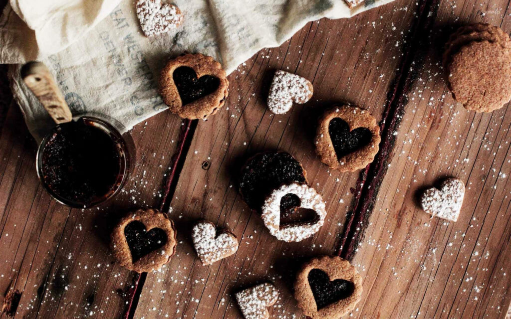 Cozy Heart-Shaped Brown Cookies Wallpaper with Chocolate Spread