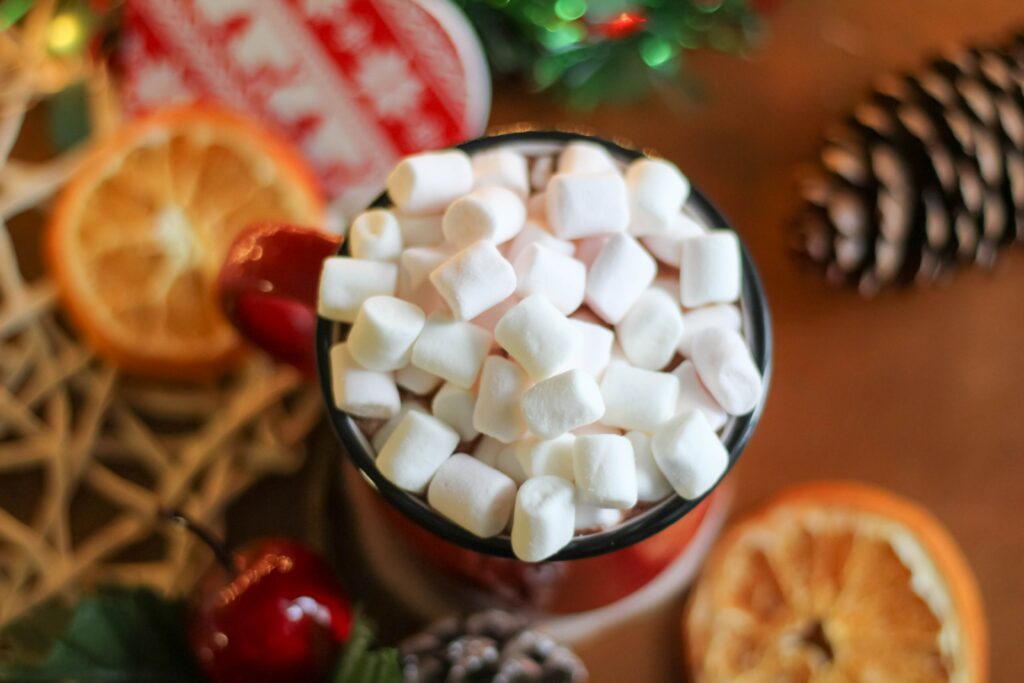 Cozy Wallpaper: Mug of Marshmallows with Dried Oranges & Festive Decor