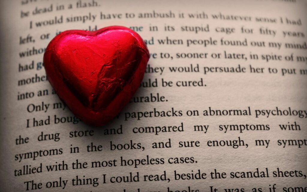 Cozy Red Heart on Book - Warm Wallpaper Background