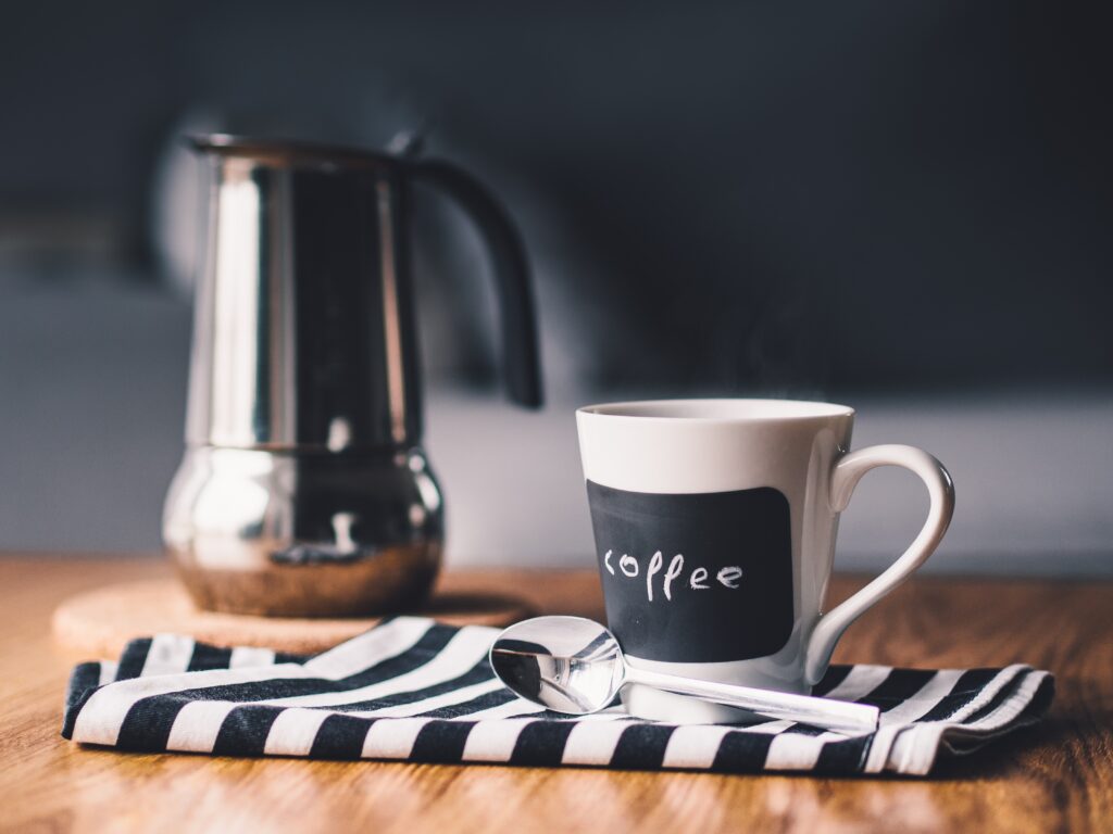 Cozy Wallpaper: Ceramic Coffee Cup & Kettle for a Relaxing Space