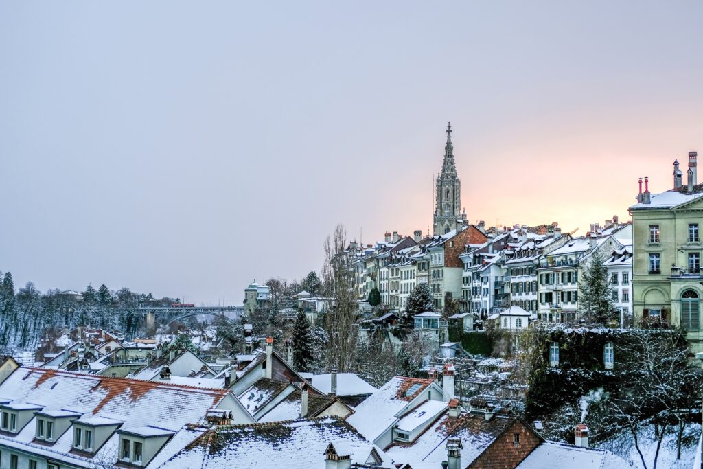 Cozy Winter Town Wallpaper: Snowy Rooftops & Serene Atmosphere