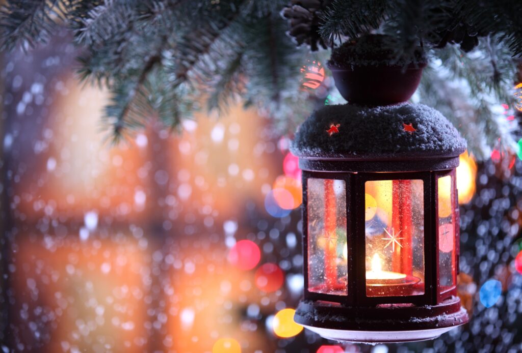 Cozy Winter Scene: Lantern Glow & Sparkling Holiday Background Wallpaper