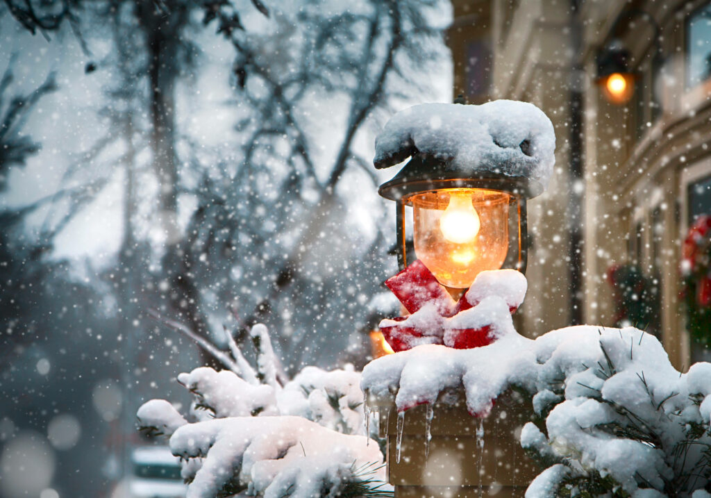 Cozy Lantern with Red Ribbon in Charming Christmas Snowy Scene Wallpaper