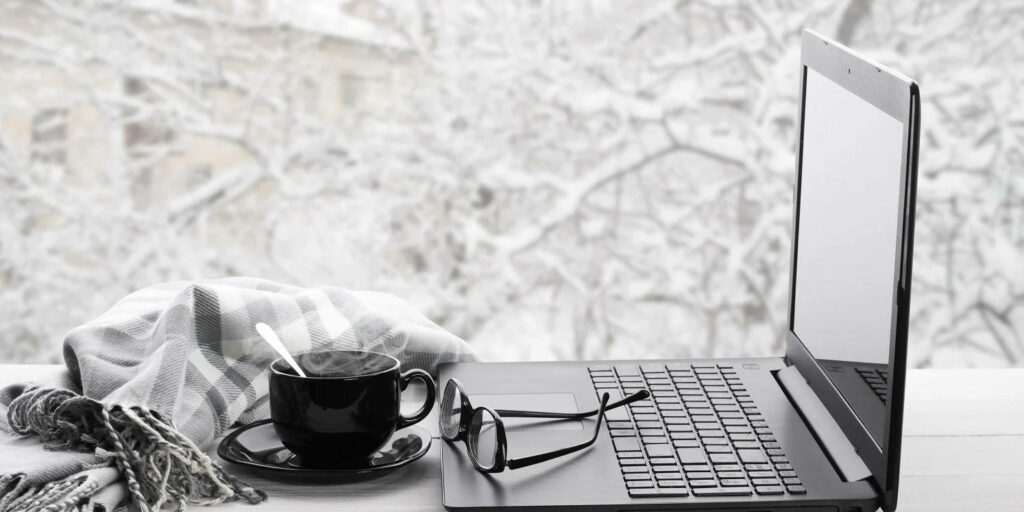 Cozy Winter Wallpaper: Laptop & Coffee by Frosted Window