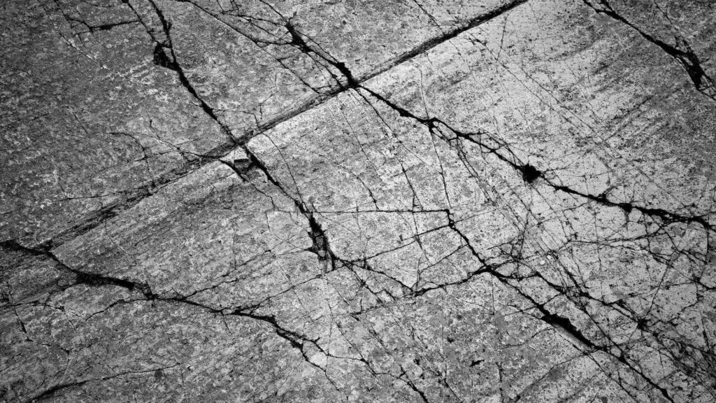 Intricate Cracked Gray Stone Wallpaper Background for Rustic Aesthetic
