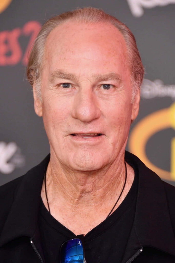 Craig T Nelson close-up portrait vibrant red yellow background distinguished confident actor Wallpaper