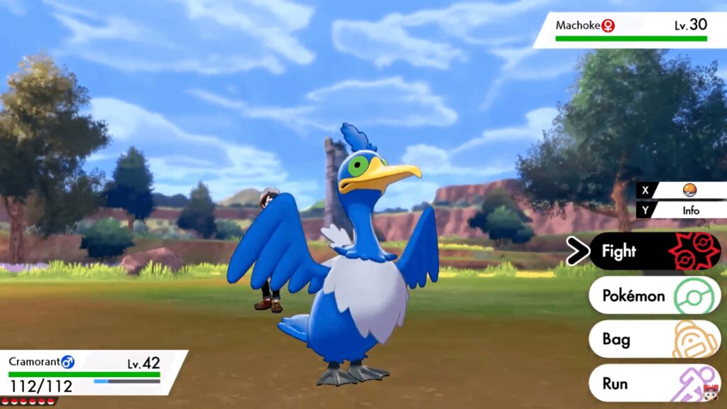 Vibrant Pokémon wallpaper with Cramorant in battle on bright rocky landscape and blue sky