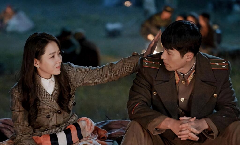 Yoon Se-ri and Ri Jeong-hyeok cozy by campfire under night sky Crash Landing On You wallpaper background