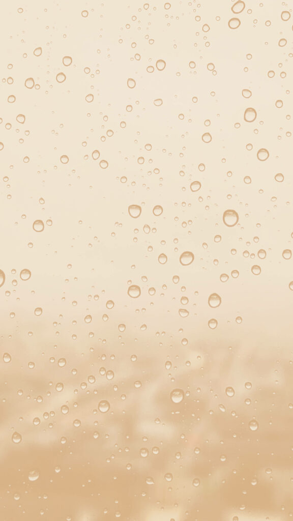 Creamy Rainfall: Captivating Image of Raindrops on a Glass Surface with Cream Aesthetic Background Wallpaper