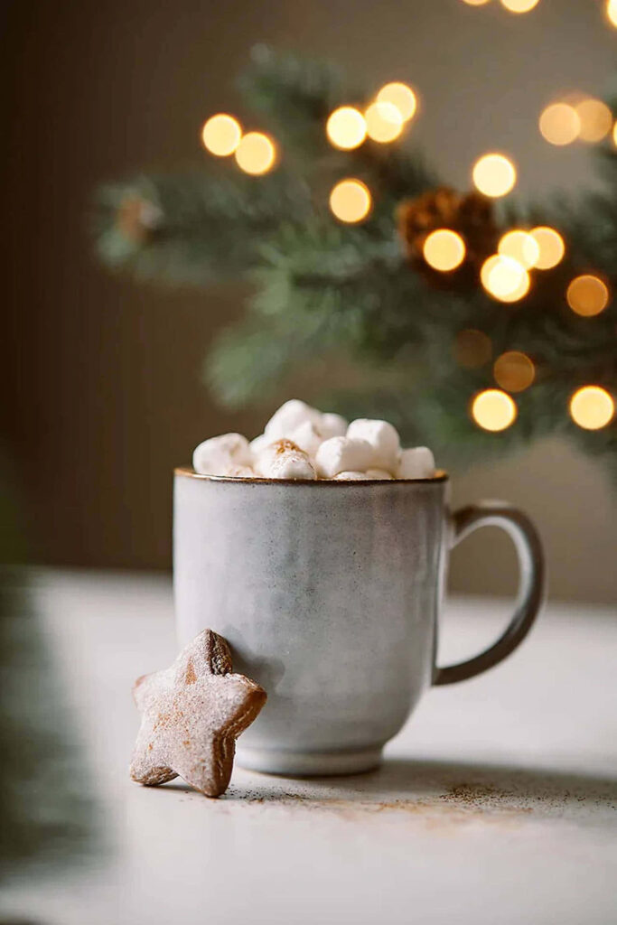 Transform Your Home into a Cozy Christmas Haven with Festive Decorations, Comfortable Seating, Inviting Lighting, and a Charming Christmas Tree Wallpaper