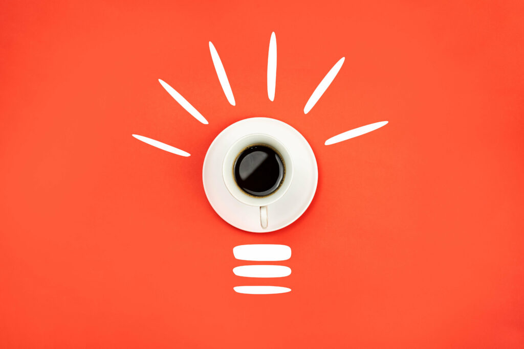 Vibrant Orange Coffee Light Bulb Wallpaper: Energy & Inspiration