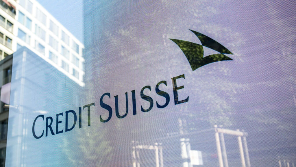 Credit Suisse logo with bold black text on modern translucent urban background wallpaper