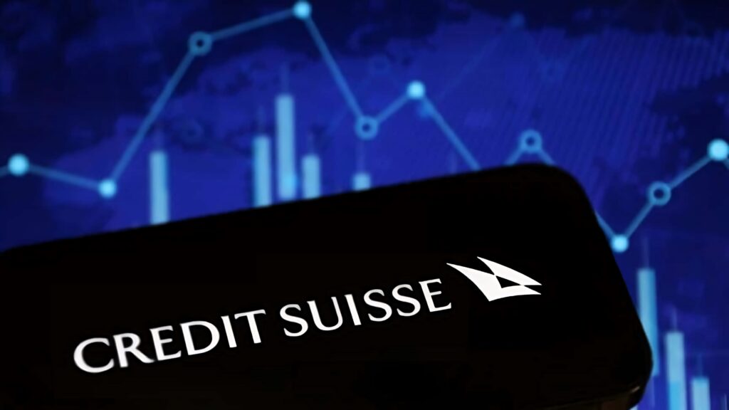 Credit Suisse logo on dark foreground with blue financial graph background market analysis wallpaper