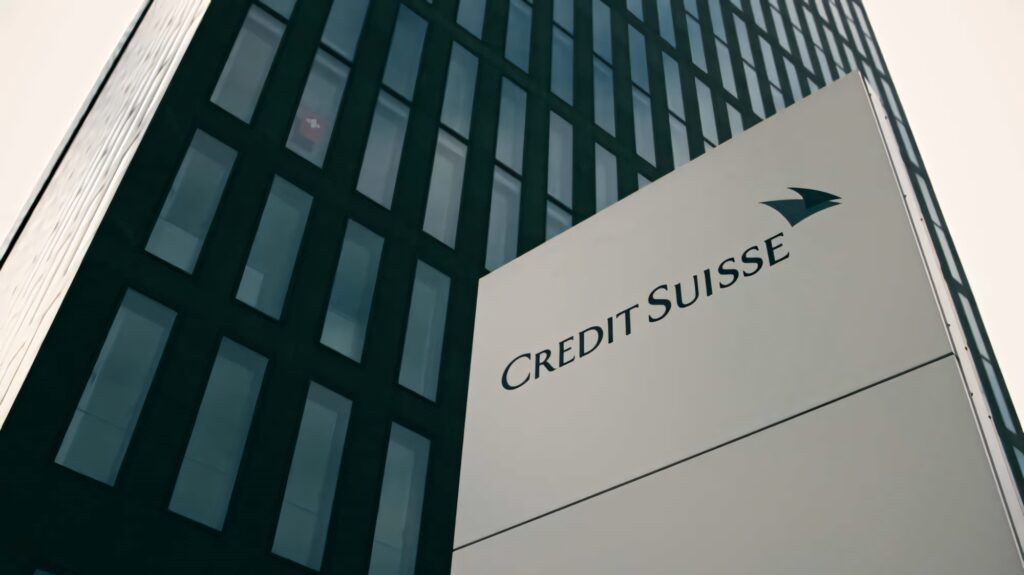 Credit Suisse building modern architecture sharp lines reflective glass facade corporate logo wallpaper