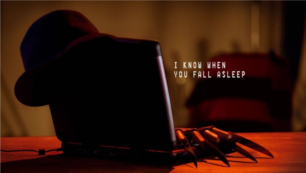 Creepy Freddy Krueger wallpaper with razor glove on laptop fedora and red black sweater text