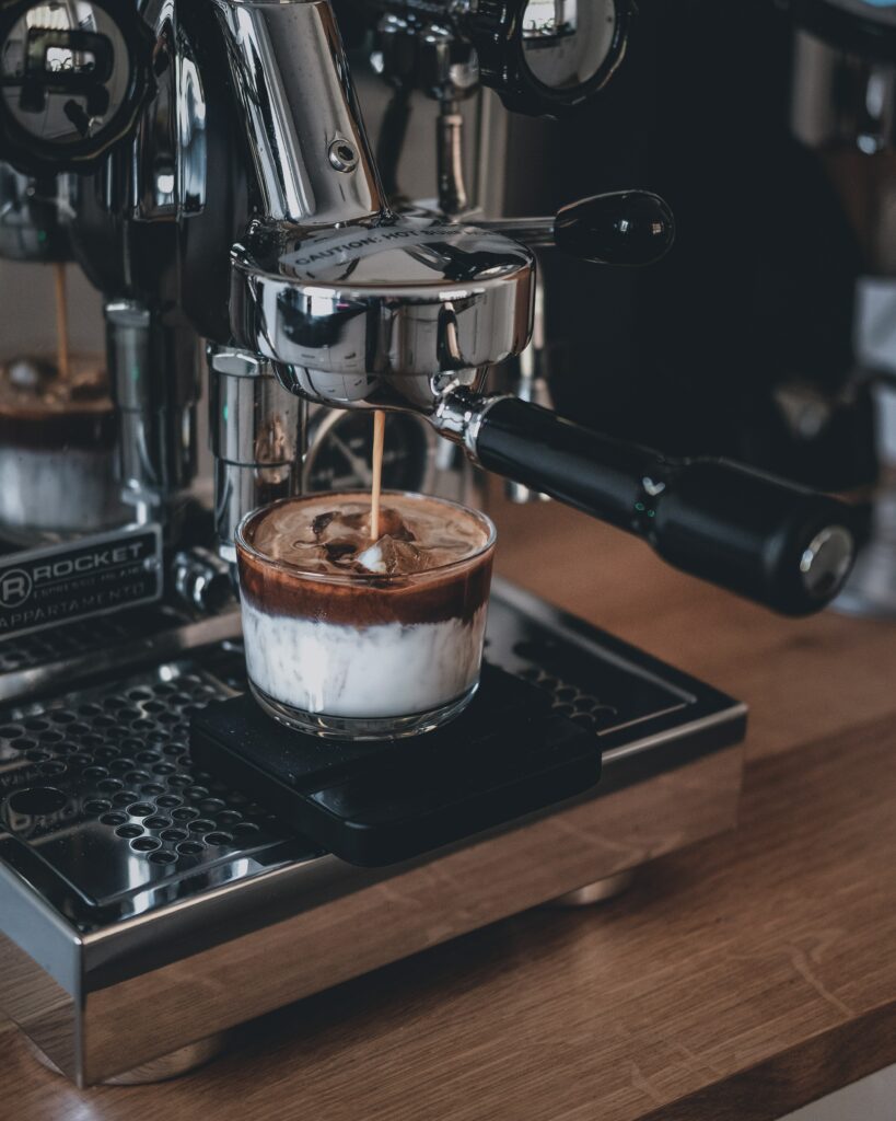 Chic Coffee Machine: Crafting Creamy Iced Espresso Delight Wallpaper