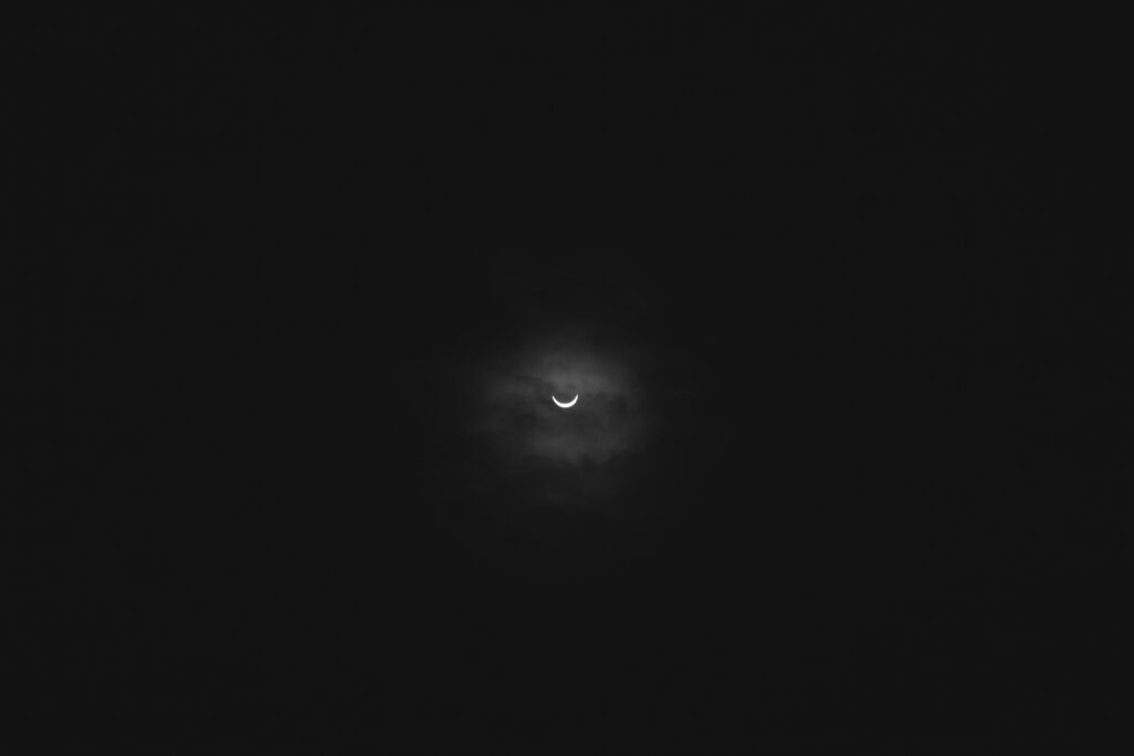 Stunning Moon Eclipse Wallpaper: Crescent Moon & Cloud Drama