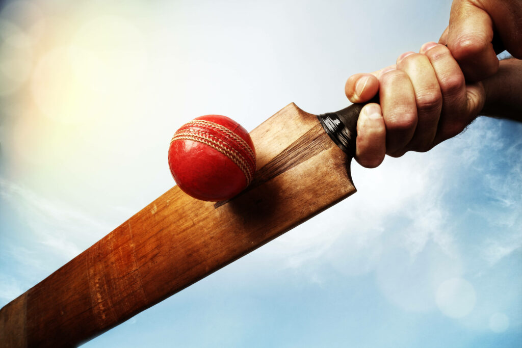 Dynamic 4K Wallpaper: Capturing the Intensity of a Cricket Ball Meeting a Racket in Mid-Air