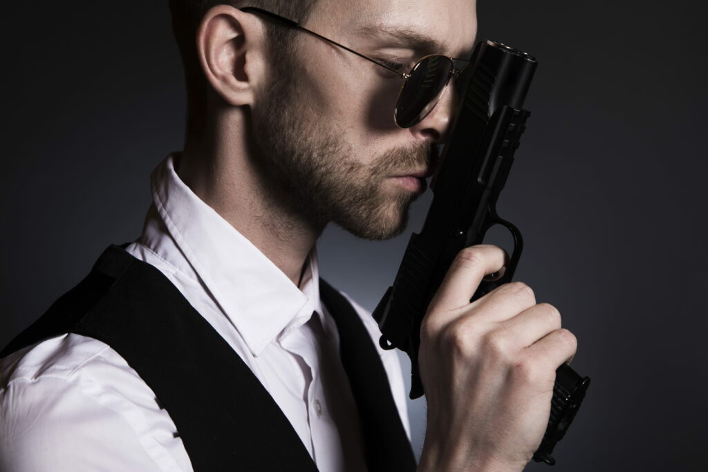 Crime Boss: A Gangster Man with a Gun in a Mafia Wallpaper