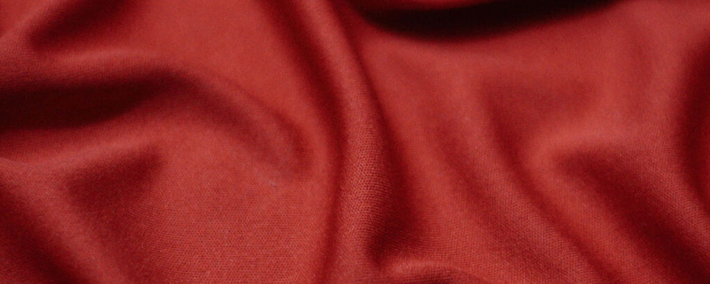 Vibrant and Intriguing: Captivating Close-Up of Textured Red Silk in Ultra-Wide HD Wallpaper