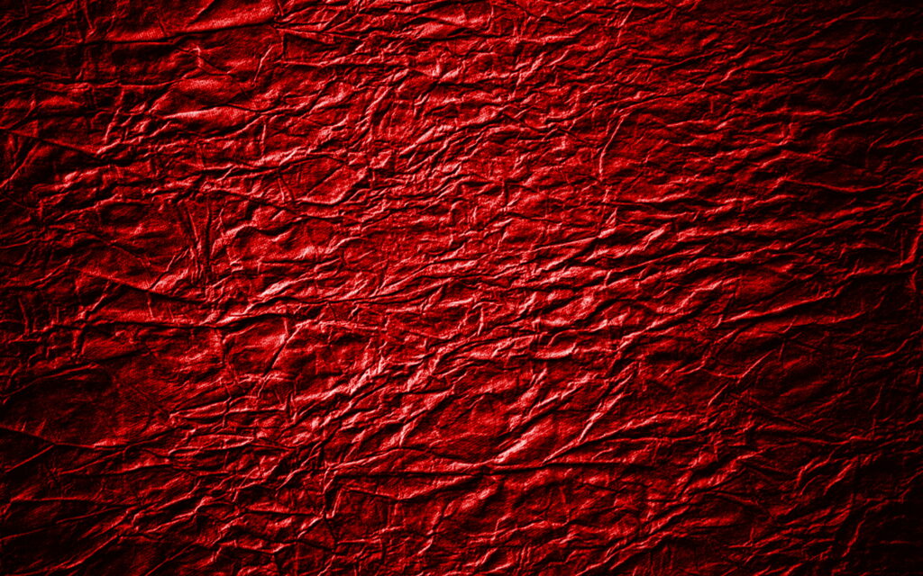 Crimson Elegance: A Macro View of Red Leather Patterns in QHD Wallpaper Background