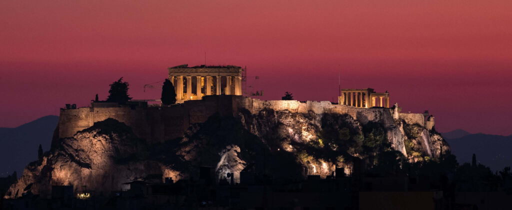 Stunning Athenian Acropolis Wallpaper: Crimson Sky Glow Background