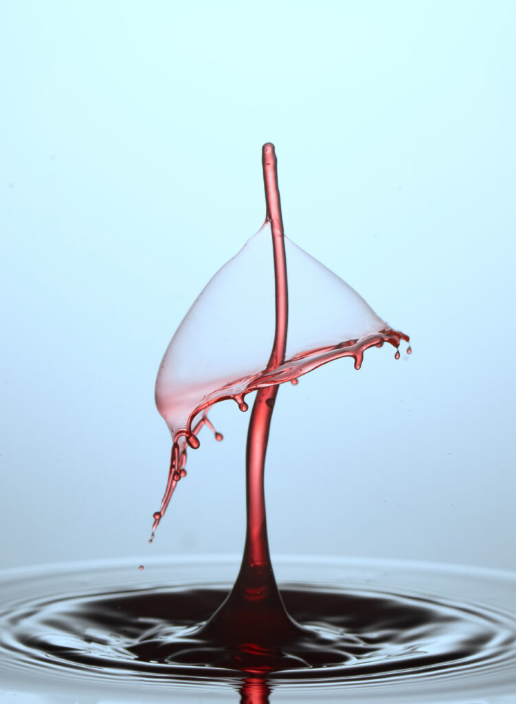 Crimson Liquid Splash Umbrella Wallpaper - Mesmerizing Background