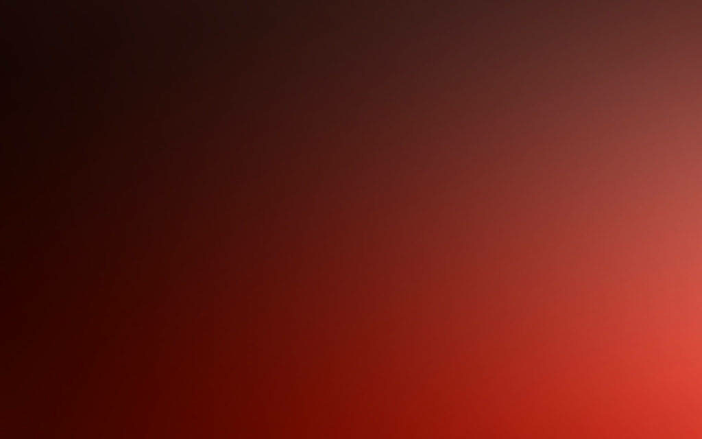 Infinite Red: A captivating radial gradient shifting from soft to bold red hues Wallpaper