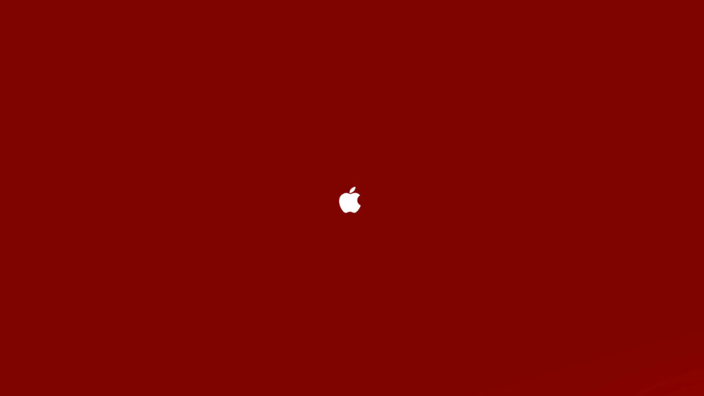 Minimalist Elegance: A Captivating 4k Ultra HD Wallpaper Featuring Apple's Iconic Logo on a Dark Red Background
