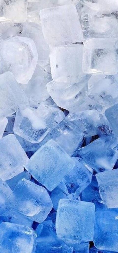 Macro photo of dense translucent ice cubes with blue white gradients crisp refreshing wallpaper