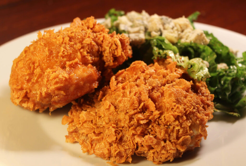 Crispy Golden Brown Chicken Pops & Fresh Salad Wallpaper Background