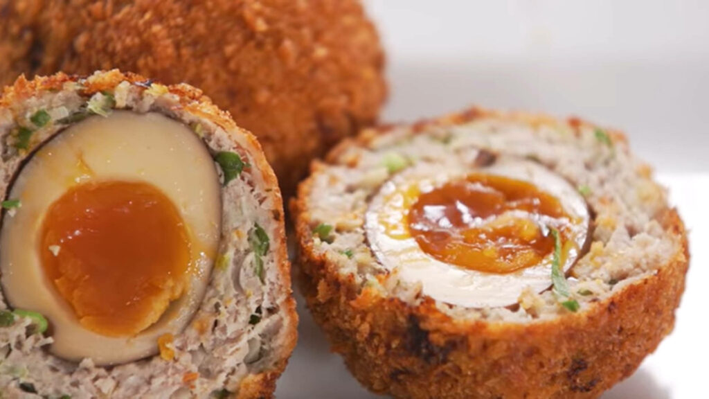 Close-Up of Traditional British Scotch Eggs: Crispy & Savory Delight Wallpaper
