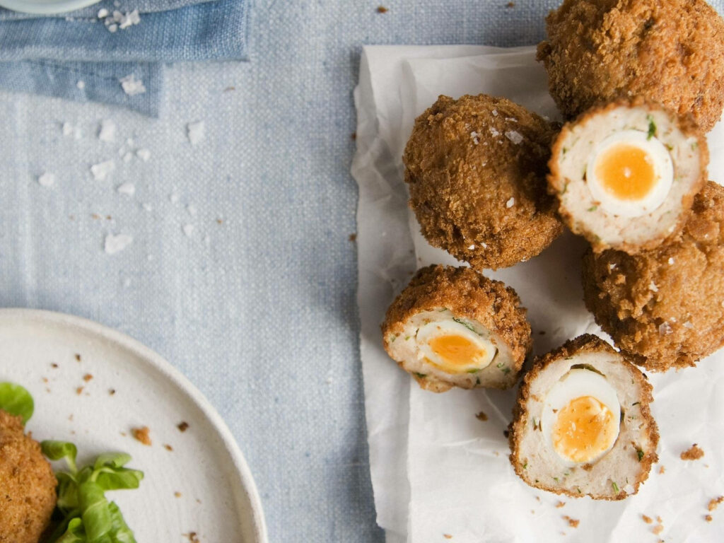 Crispy Golden Scotch Eggs Wallpaper for a Delicious Kitchen Decor