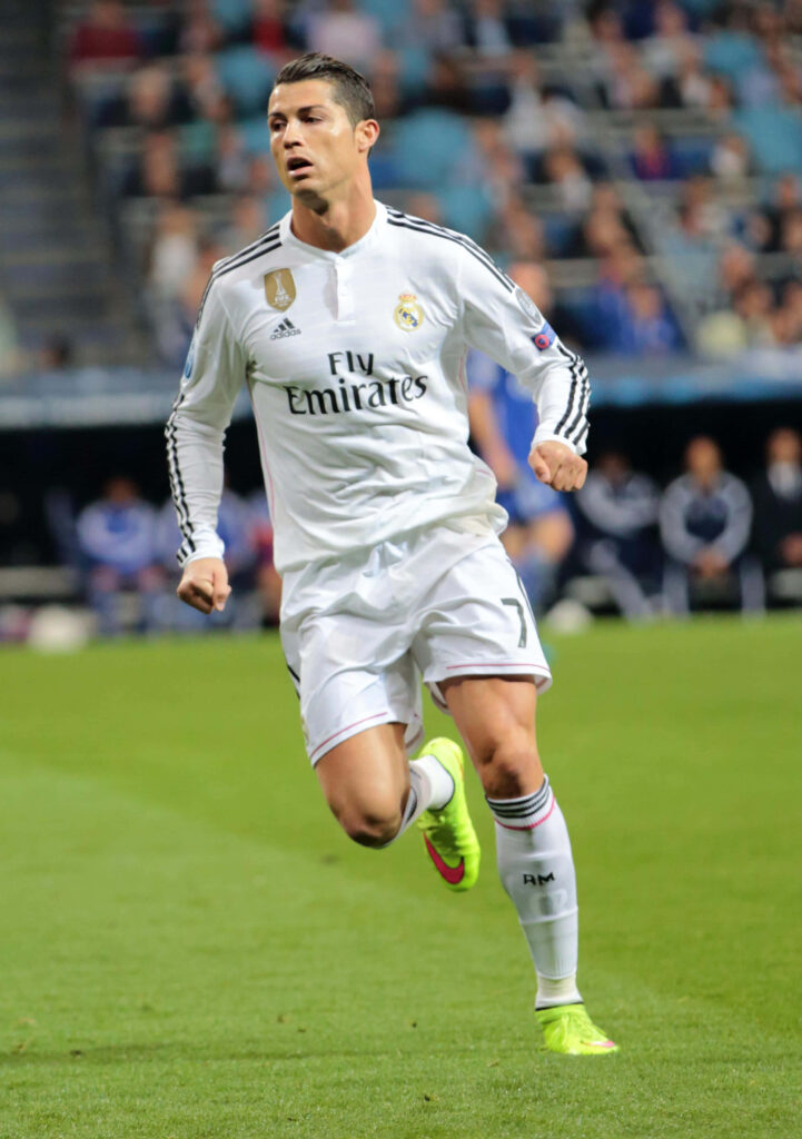 Cristiano Ronaldo Action Wallpaper: Intense Football Match Background