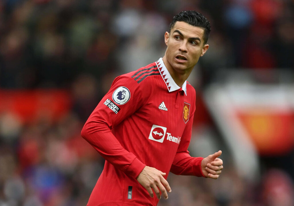 Epic Cristiano Ronaldo Wallpaper: Intense Action in Red Jersey