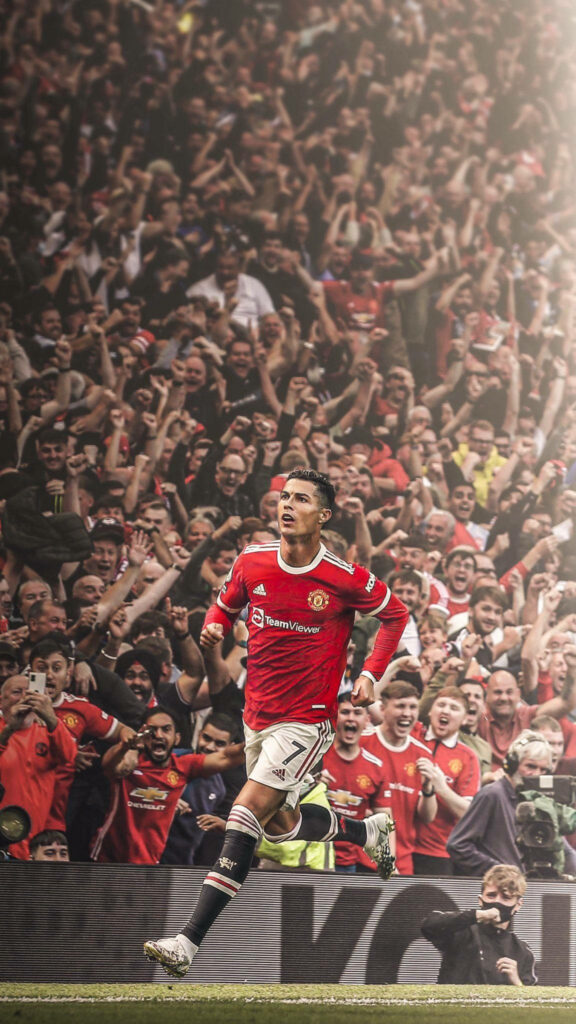 Electrifying Cristiano Ronaldo Wallpaper: Passionate Celebration Scene