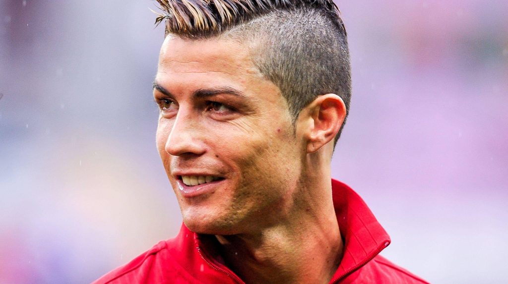 Cristiano Ronaldo close-up with disconnected undercut and red track jacket football wallpaper