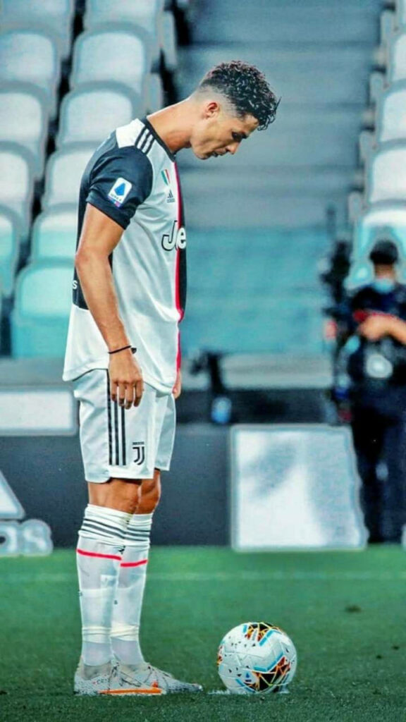 Cristiano Ronaldo Focused on Ball - Intense Football Wallpaper