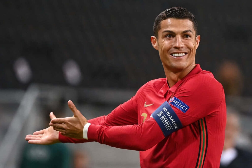 Cristiano Ronaldo Wallpaper: Iconic Pose in Vibrant Game Moment