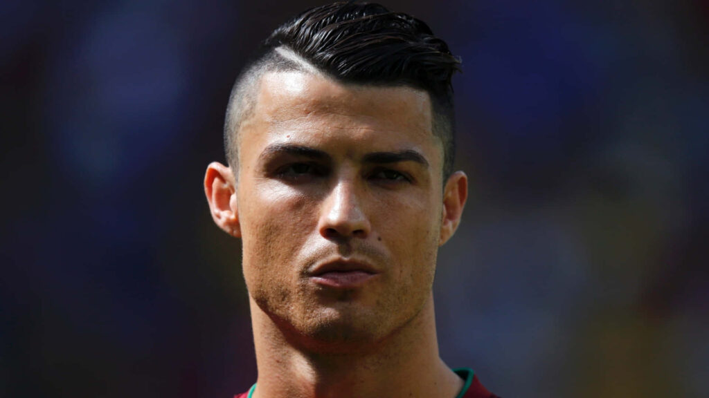 Cristiano Ronaldo Wallpaper: Iconic Look & Intense Focus Background