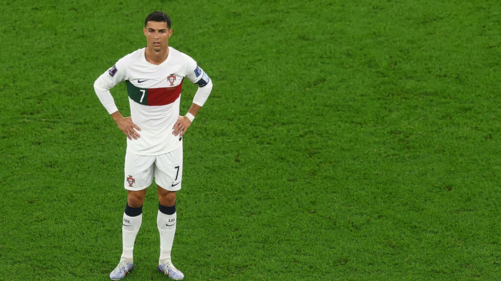 Cristiano Ronaldo Wallpaper: Portugal's Icon on Lush Green Field