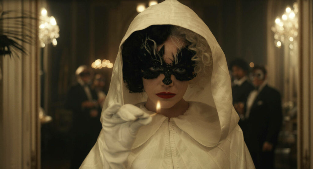 Stylish Cruella Wallpaper: Elegant Cape & Black Mask Background