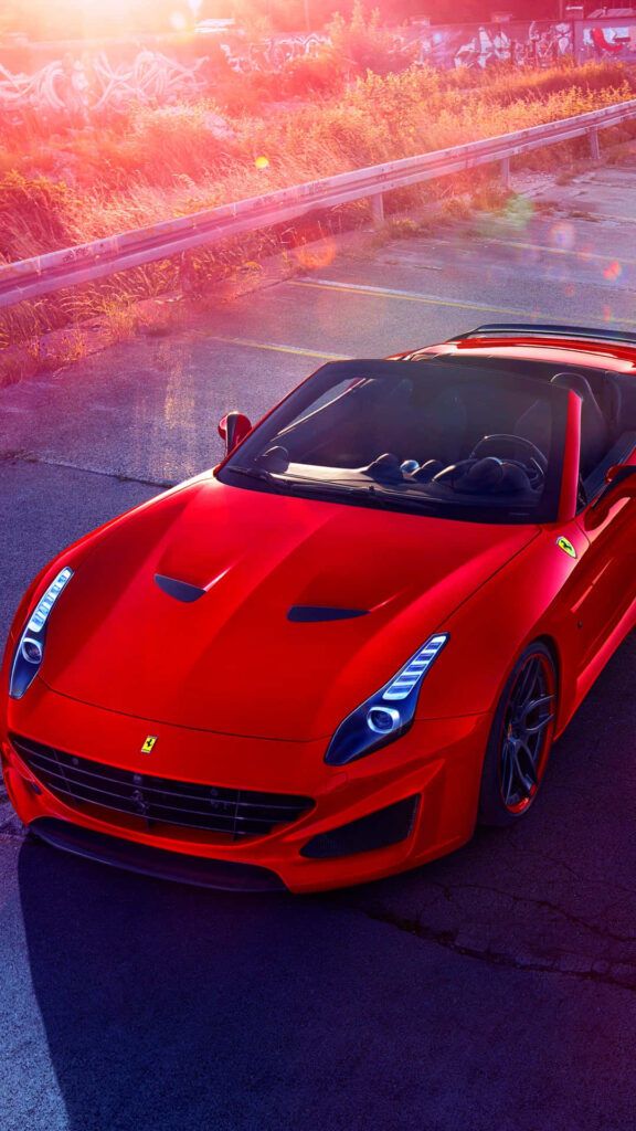Exuding Power and Elegance: Unleashing the Unmatched Allure of the Red Ferrari California T on the Open Road Wallpaper