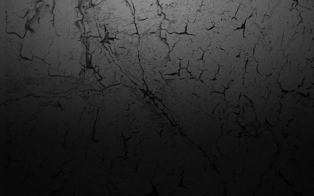 Cracked Charcoal: A Minimalist HD Wallpaper of a Dark Gray Surface