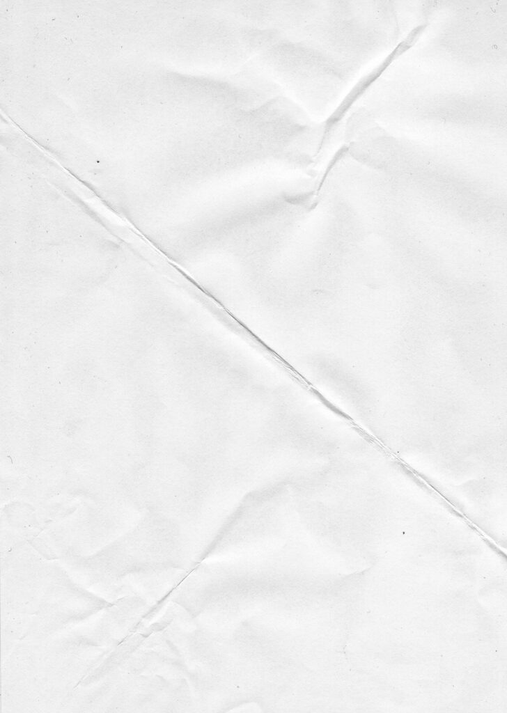 Crumpled Texture: White Printer Paper with a Creased Wallpaper Background