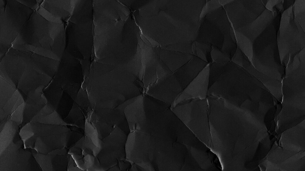A Crumpled Paper Design on Blank Black Wallpaper Image