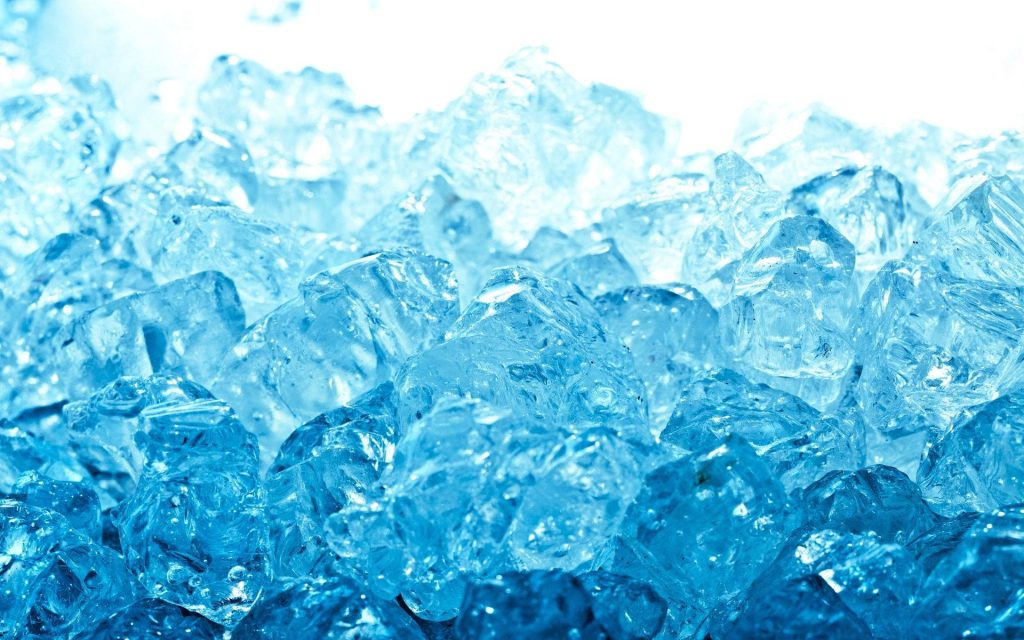 Macro photo of crystalline blue ice cubes with sharp detail and refreshing cool background Wallpaper