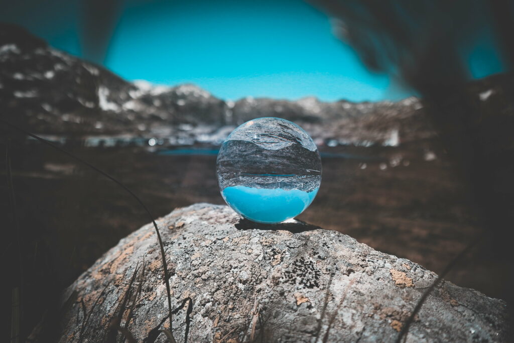 Mystical Reflections: Crystal Ball Unveiling Nature's Enigma Wallpaper