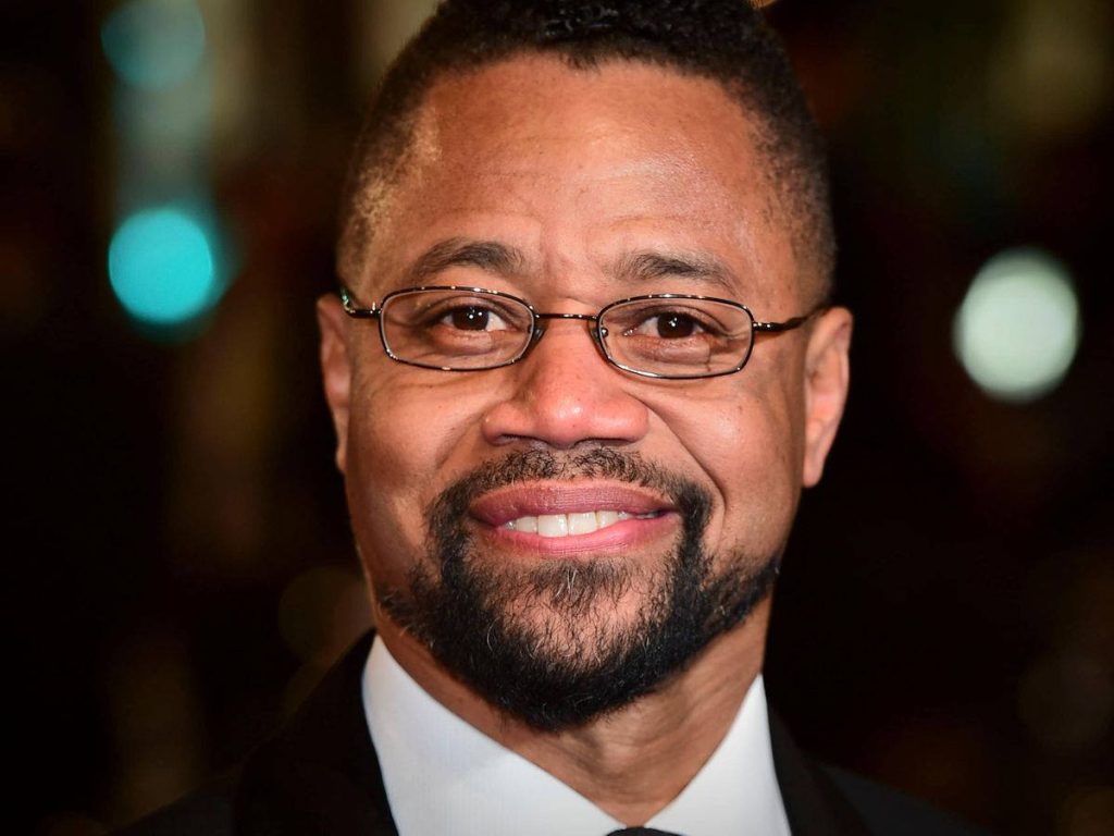 Cuba Gooding Jr professional portrait with glasses sharp suit warm smile elegant bokeh background Wallpaper