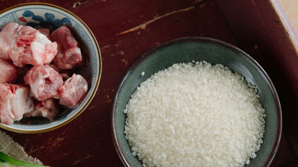 Culinary Wallpaper: Uncooked Rice & Raw Meat in Green Bowl